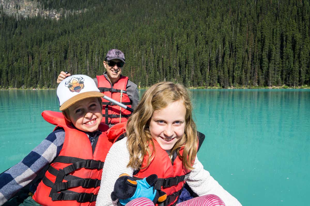 Dan Brewer and two kids canoeing on Lake Louise in Banff National Park