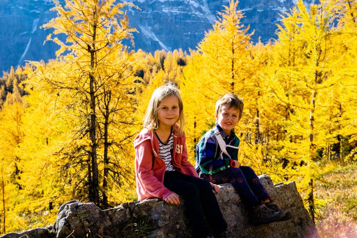 Two kids posing for picture on Banff Larch Hike