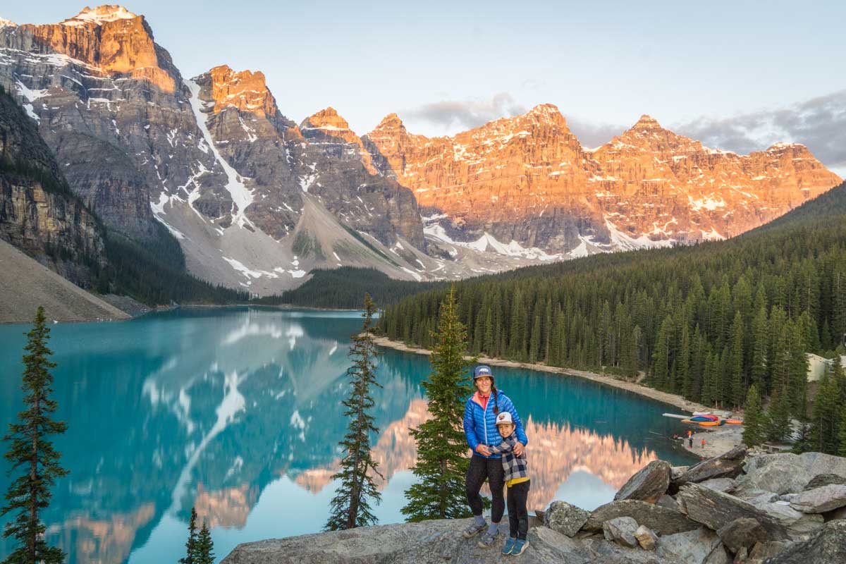 Celine Brewer and child watching sunrise at Moraine Lake