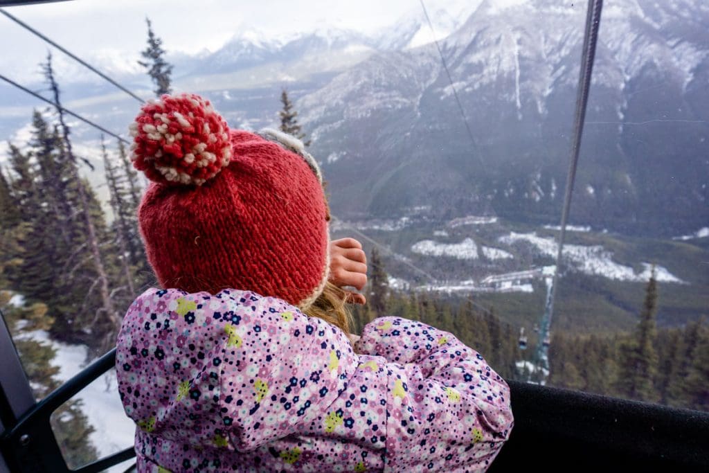 Child looking out of Banff Gondola.