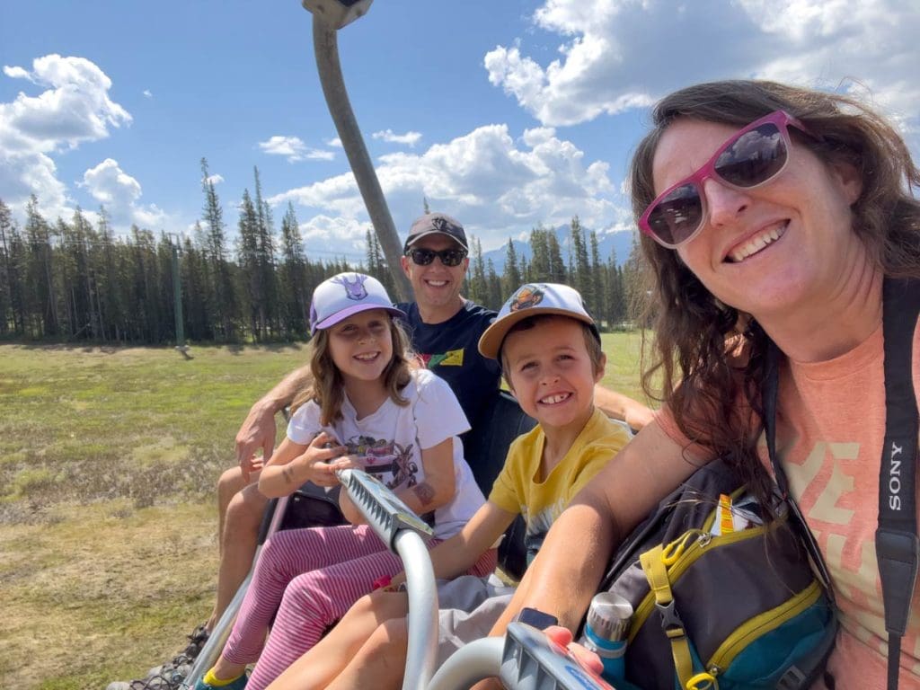 a family of four on the Lake Louise Gondola.