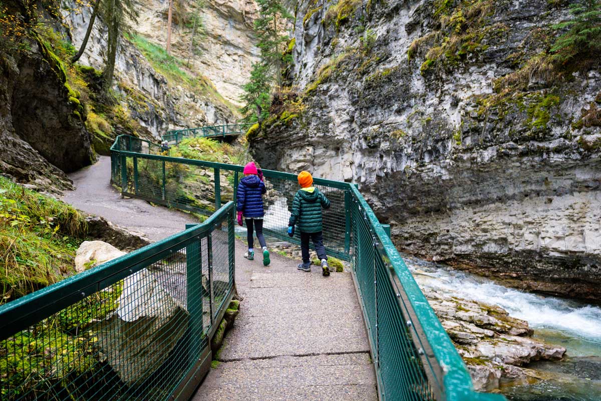 Two Kids Hiking Johnston Canyon Trail