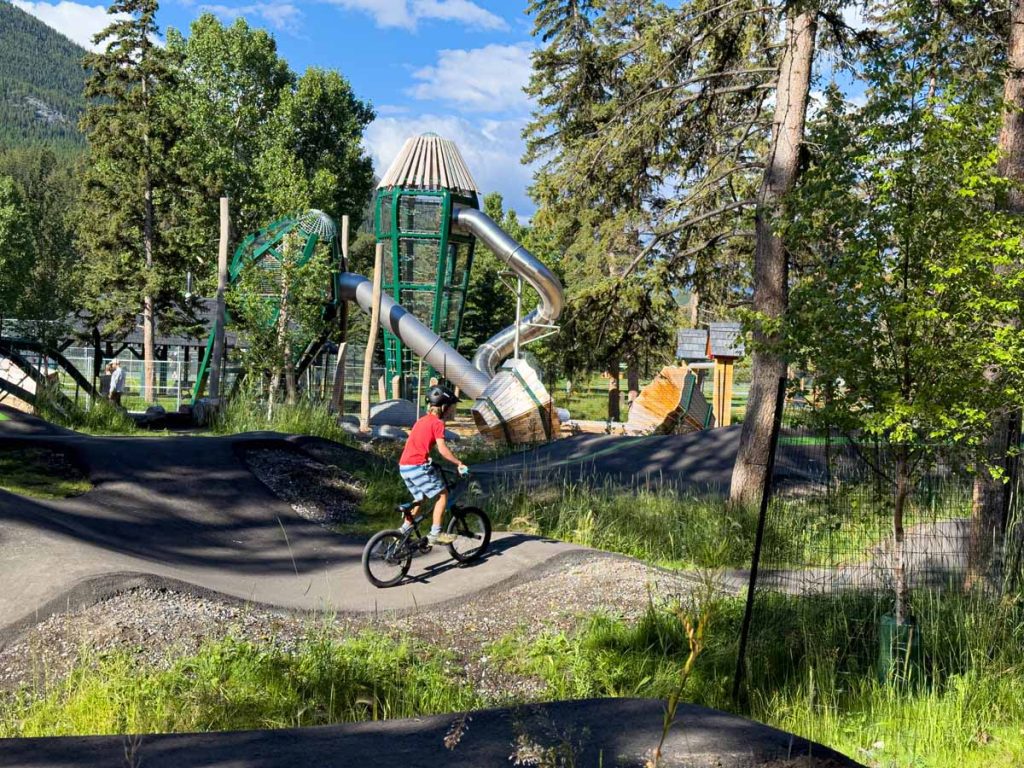 a 10-year old boy enjoys a fun morning at the Banff Pump Track.